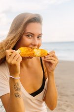 beautiful-vegetarian-girl-eat-corn-seaside-healthy-vegetarian-hipster-woman-summer-outfit-eat-...jpg