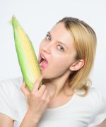 agriculture-cultivation-happy-woman-eating-corn-vegetable-harvest-corn-crop-vitamin-dieting-fo...jpg
